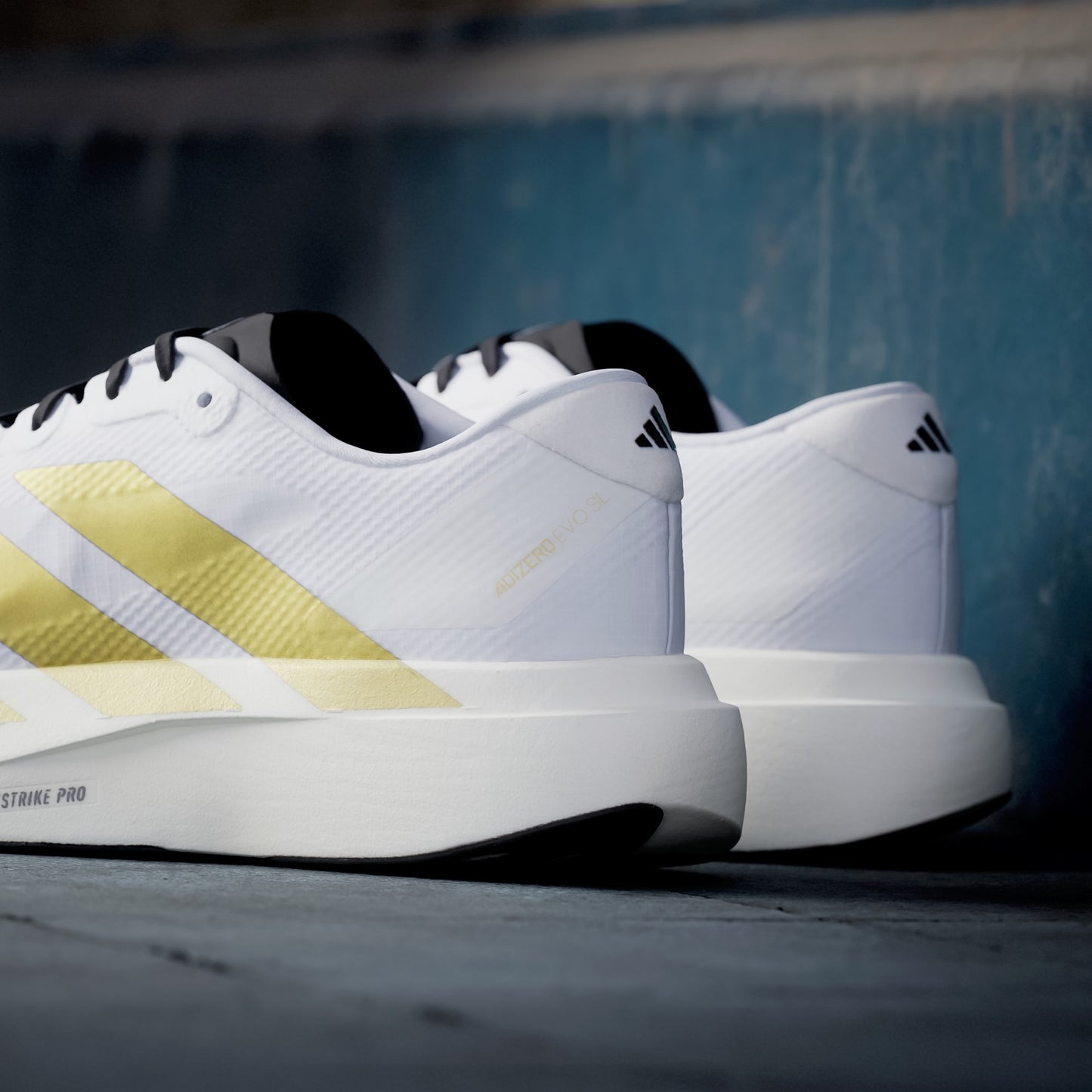 Adizero EVO SL Cloud White / Matte Gold / Core Black